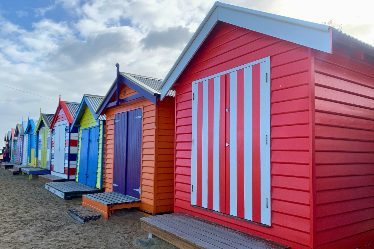 Brighton Beach bathing boxes Melbourne showing side-by-side structures, symbolising duplex development and maximising valuable land