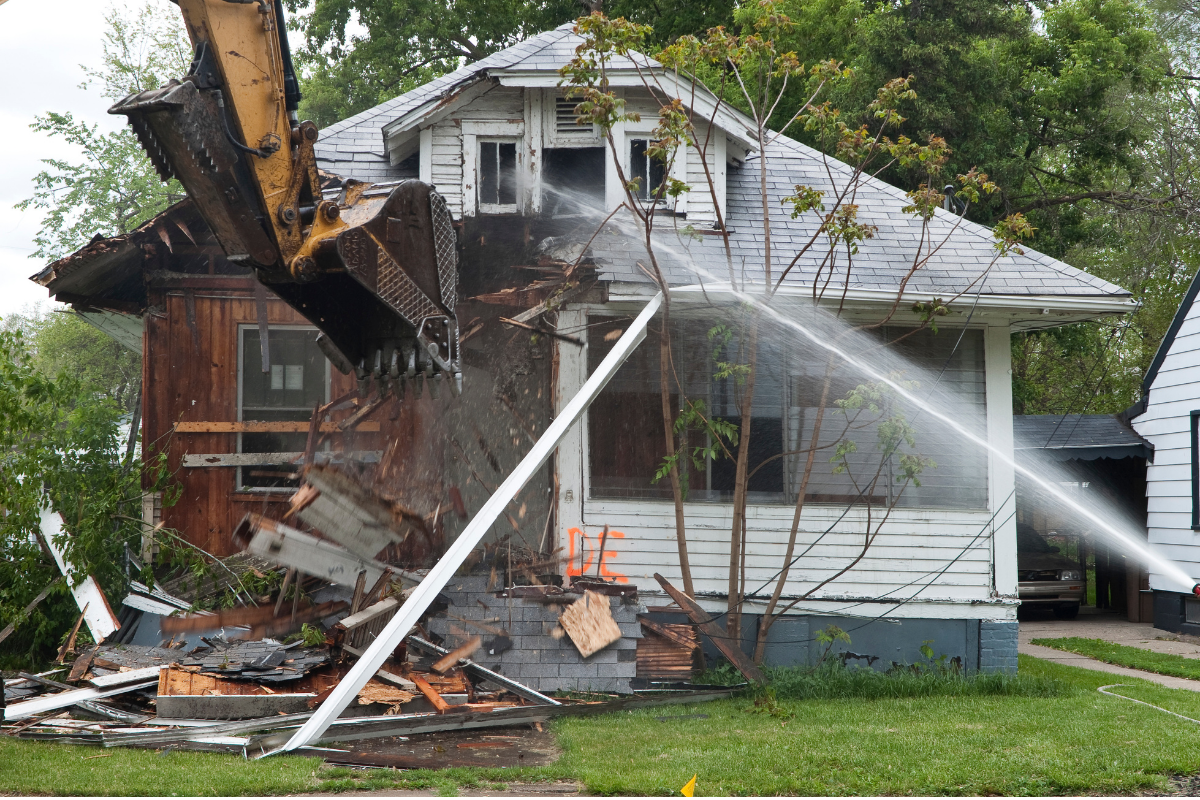 Knockdown rebuild demolition in progress Melbourne showing weatherboard cottage removal and site preparation for new custom home construction