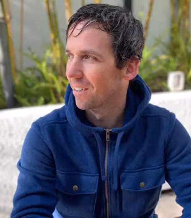 man in a blue hoodie