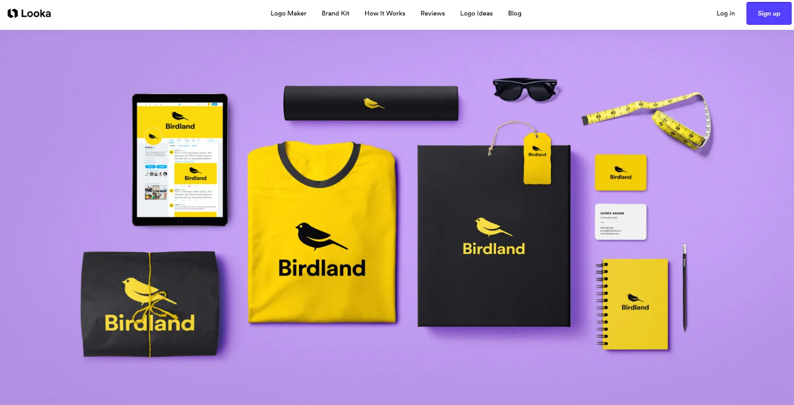 Looka homepage showcasing branded mockups for a sample “Birdland” logo across various products.