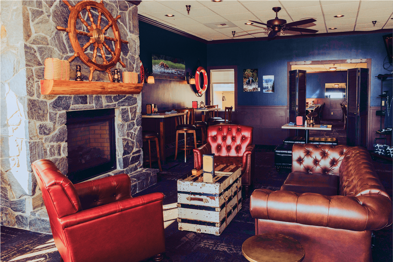 Comfortable booth seating at The Landing's Diner full of customers and home-style food.