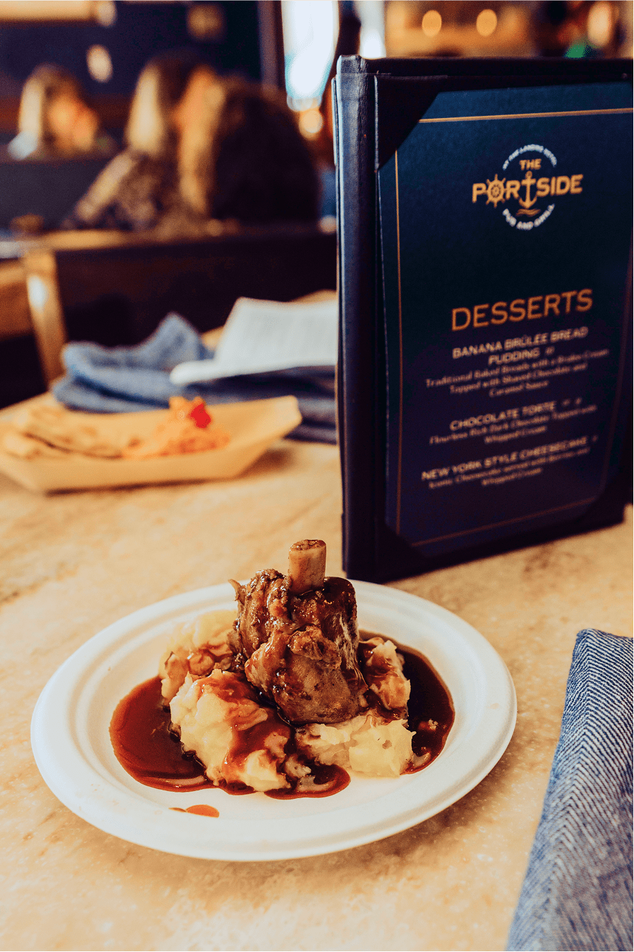 Various sections of Jeramiah's Pub, complete with bar seating, window booths, family tables, Alaskan memorobelia, and a view of the kitchen.