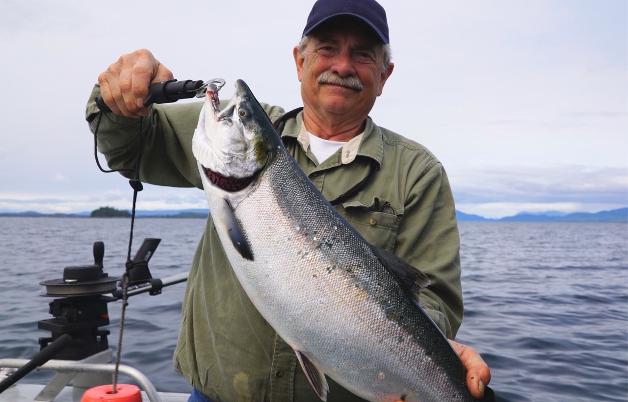 Comfortable booth seating at The Landing's Diner full of customers and home-style food.