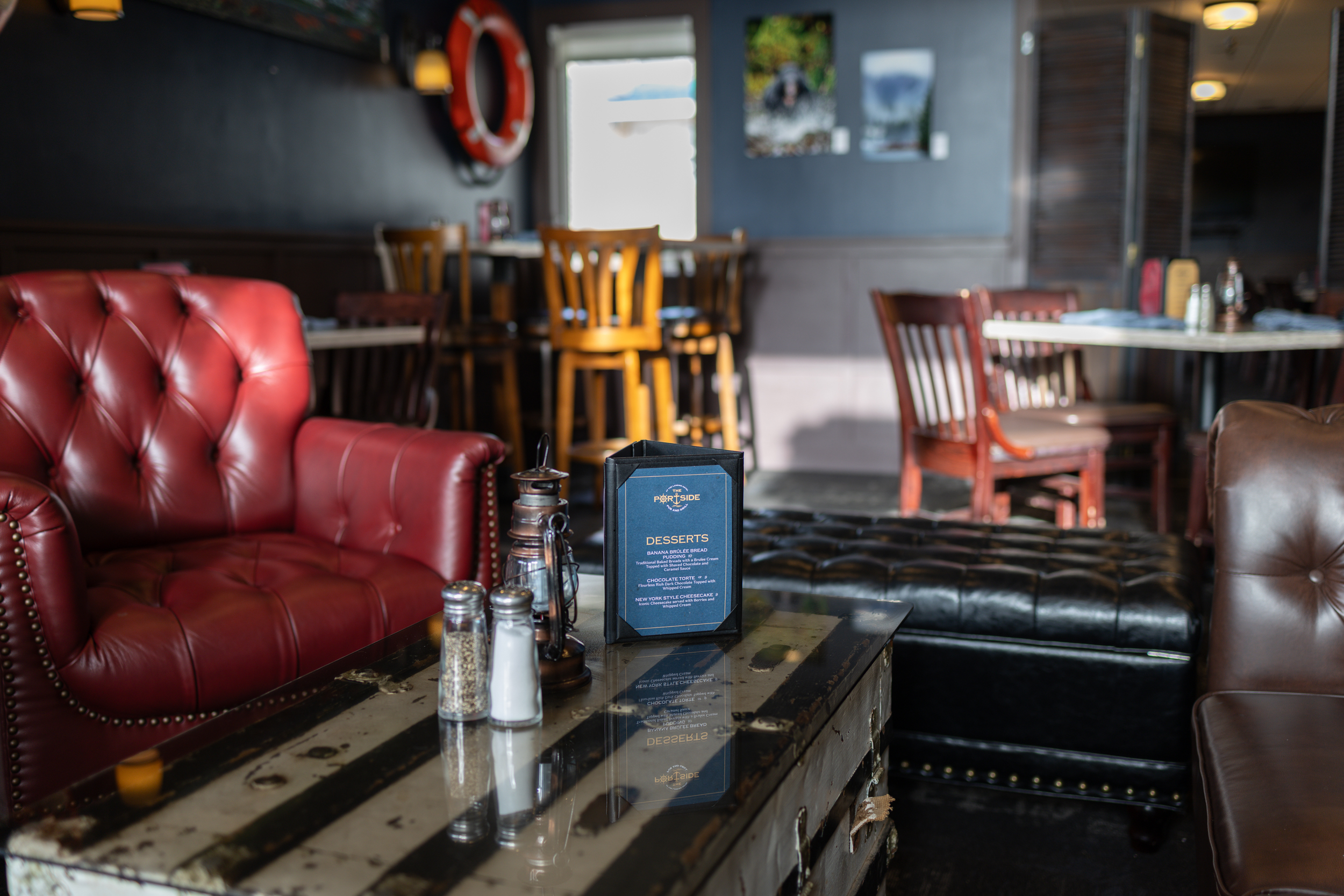Comfortable booth seating at The Landing's Diner full of customers and home-style food.