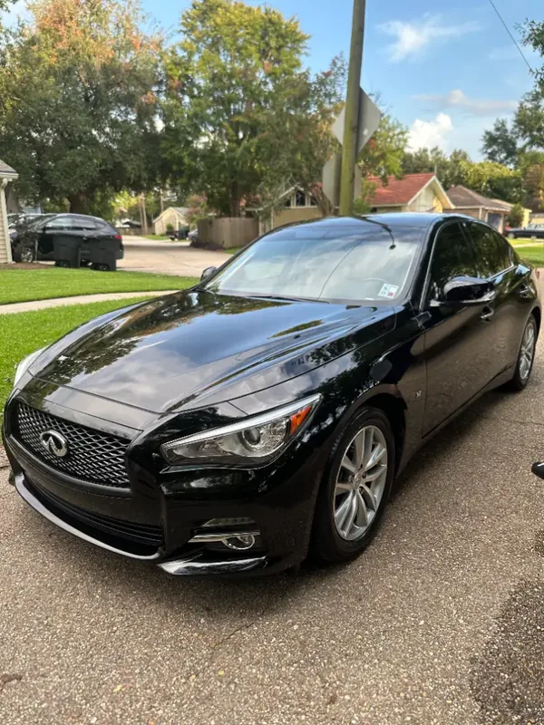 Immaculate Detailing technician applying ceramic coating protection