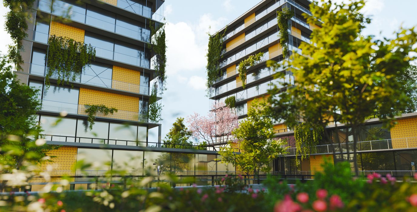 Immeubles de bureaux végétalisés entourés d'arbres et de massifs fleuris