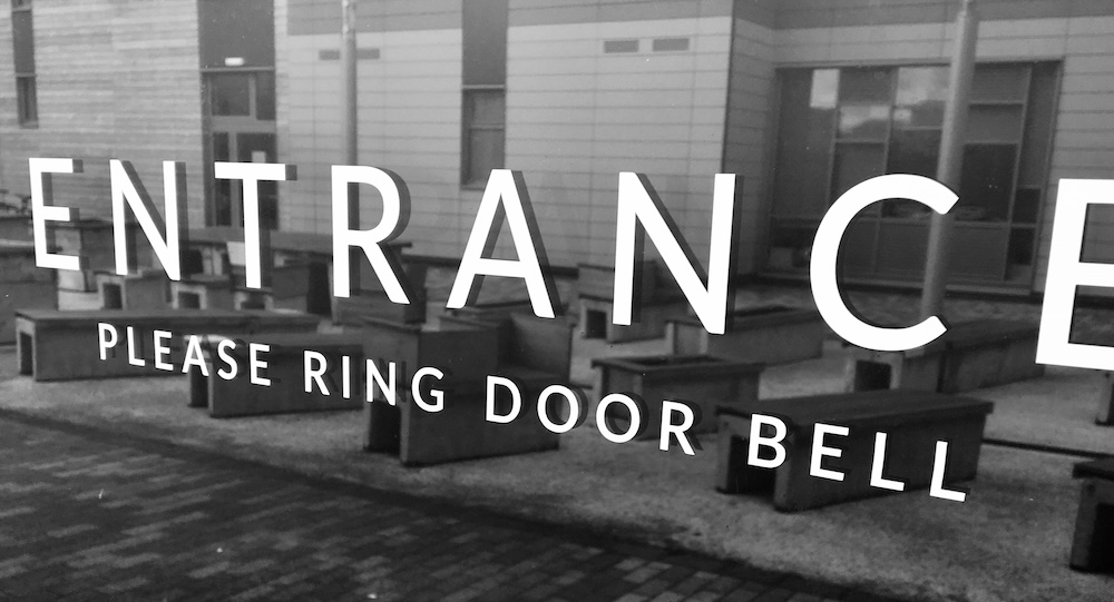 Custom shaped vinyl transfer sticker in white on a window