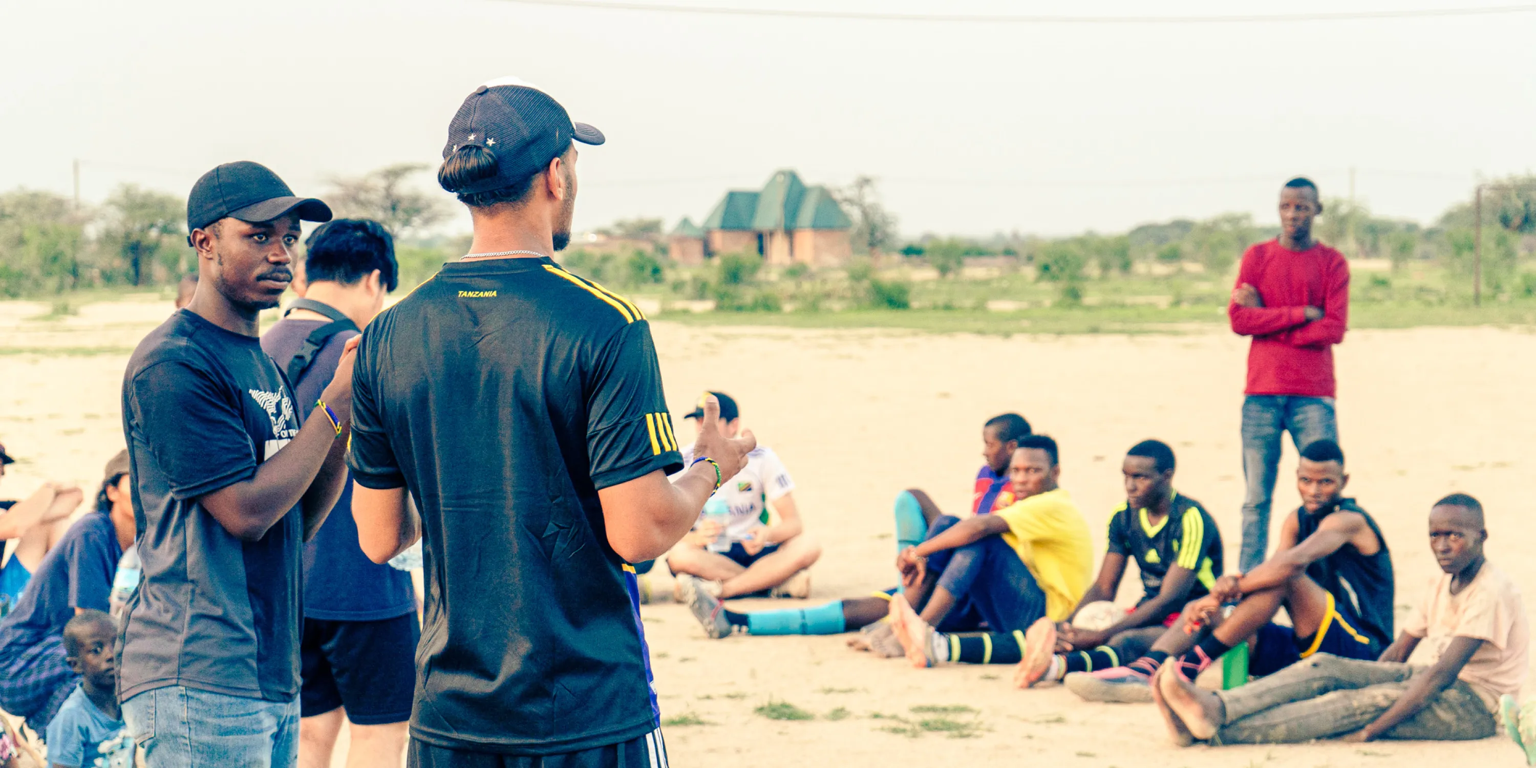 A couple of outreach students speaking in front of a group of outreach students.