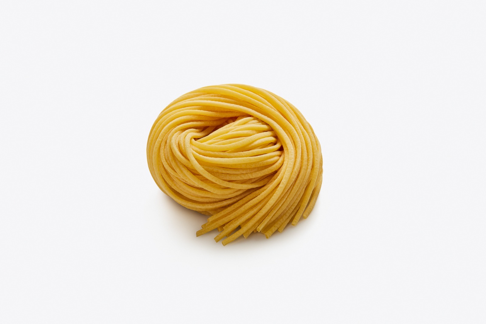 Tagliolini a Taglio — nido di pasta fresca all'uovo a nastri larghi, dall'impasto ricco all'uovo