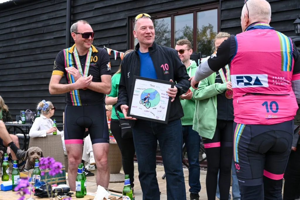 George (event organiser) holding a gift from halow project