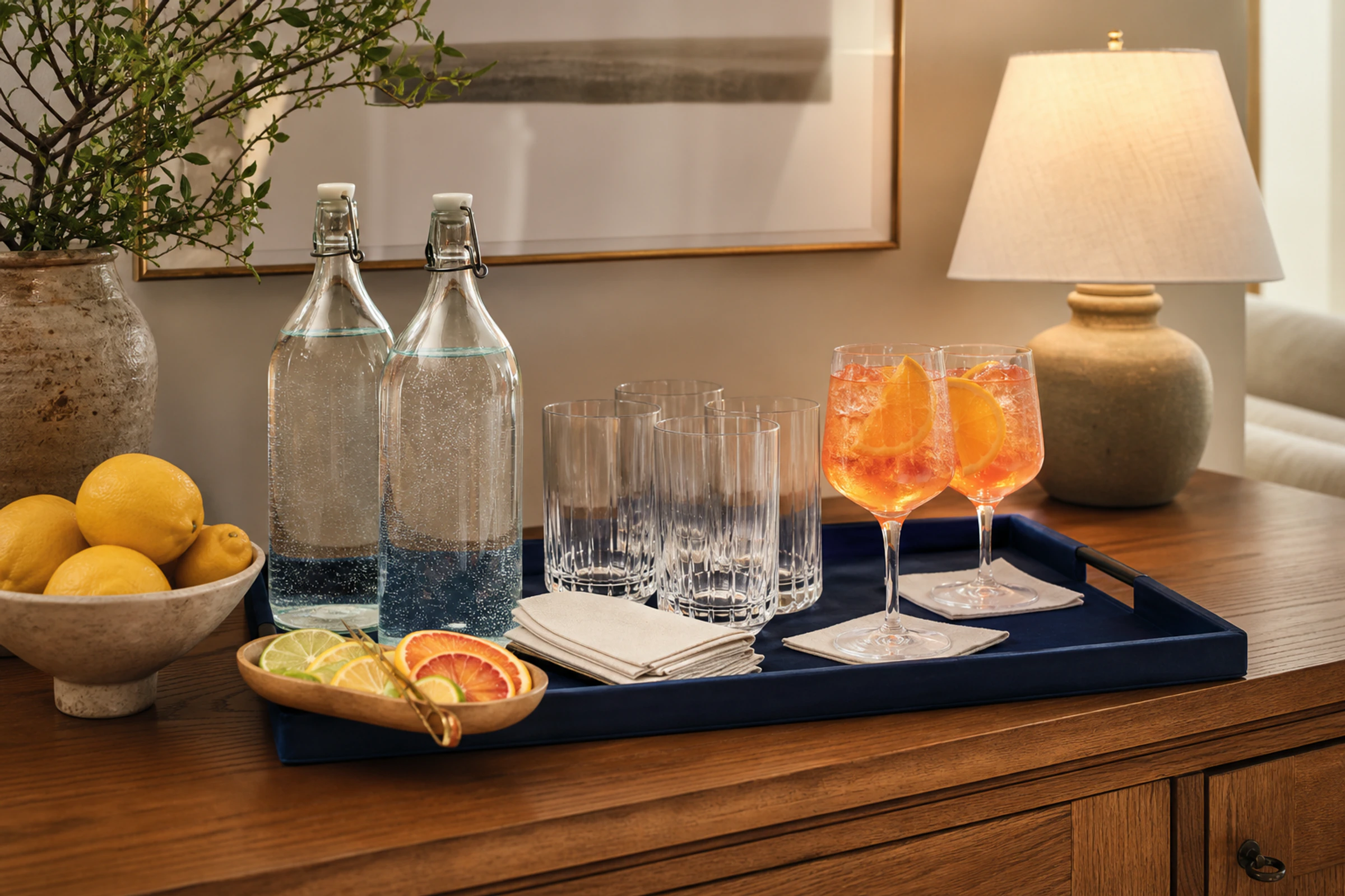 A simple drinks station offers sparkling water and a non-alcoholic spritz