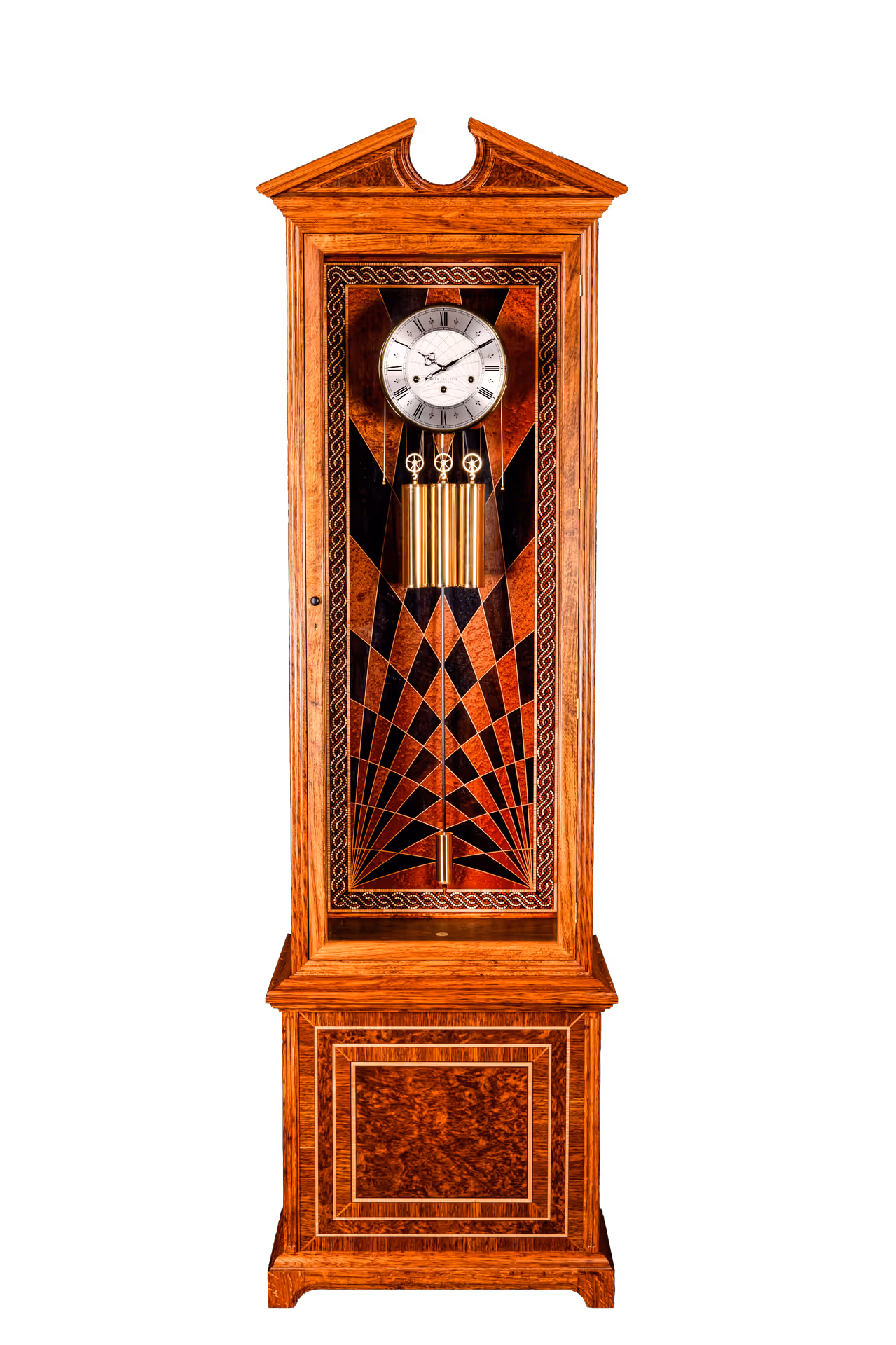 Tall antique wooden grandfather clock with geometric-patterned glass and brass pendulum weights.