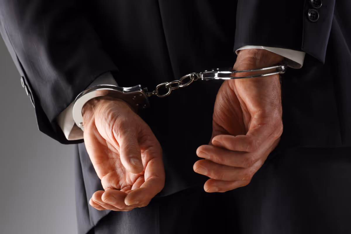 A man handcuffed.