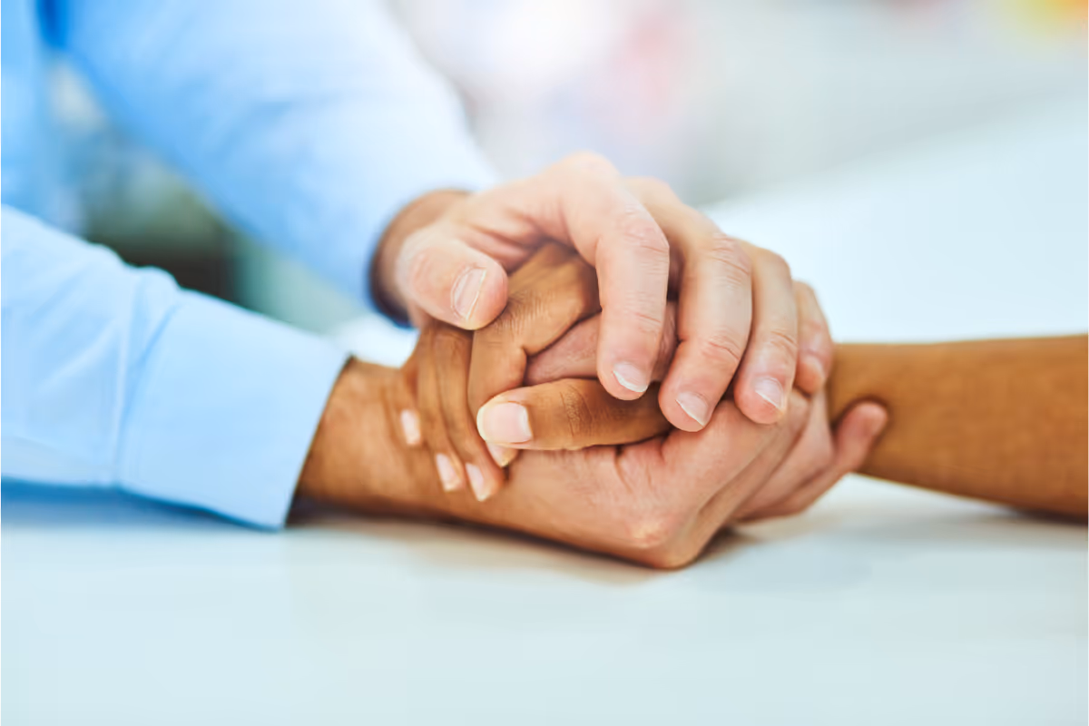 a photo of someone holding another person's hand.
