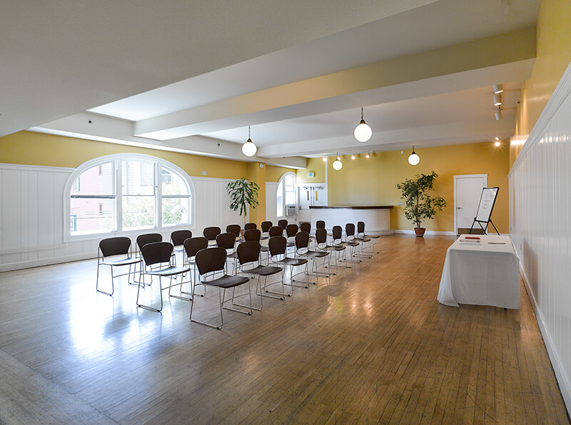 Audre Lorde Room set up in a lecture-style format with rows of chairs and a presentation table.
