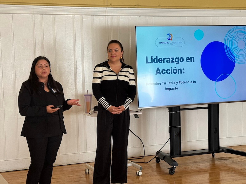 Two women lead a professional development workshop titled "Liderazgo en Acción" (Leadership in Action), helping participants discover their leadership style and maximize their impact as part of The Women’s Building’s job readiness support.