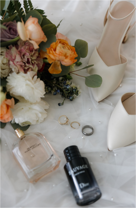 Bridal flat lay with heels, rings, florals, and perfume – styled by Lex and Trev Photography, photographed for a Taylor Nino Weddings client
