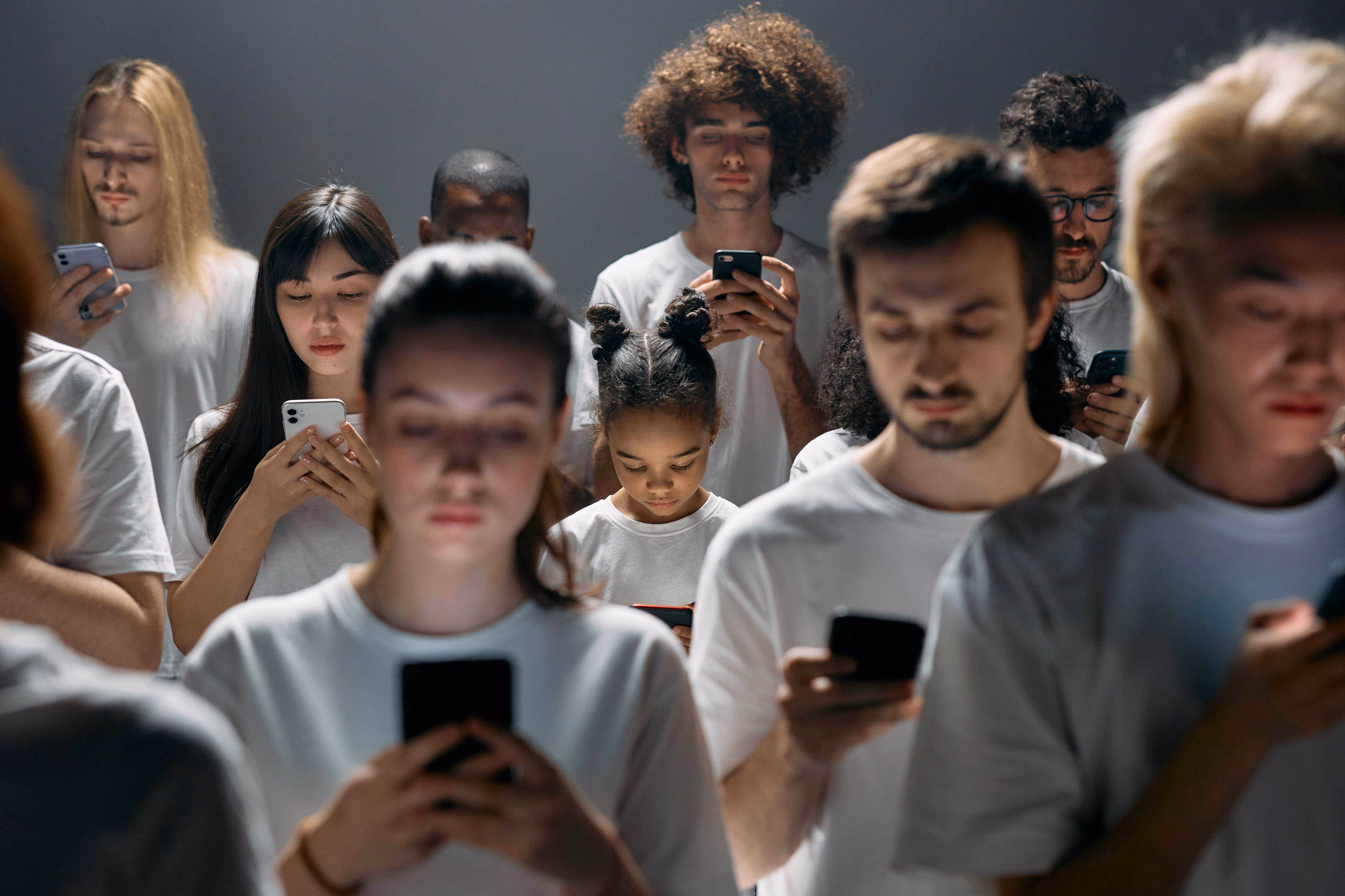 People using phones, highlighting fraud risks and payee verification needs