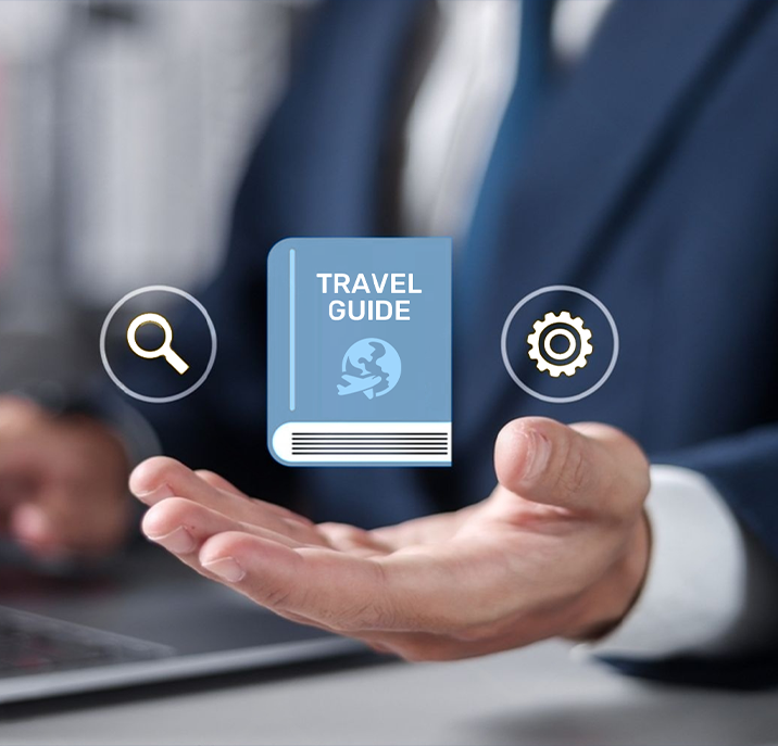 Businessperson's hand holding digital icons including a blue travel guide book with a globe and airplane symbol, a magnifying glass, and a gear.