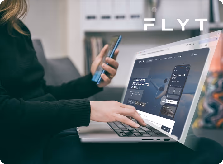A woman sitting on a couch using a laptop computer.