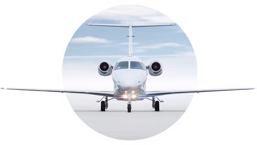 A small airplane is sitting on the runway.