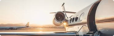 A jet airliner sitting on top of an airport tarmac.