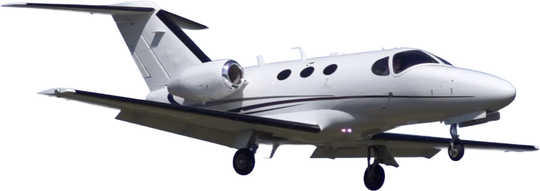A small white plane flying in the sky.