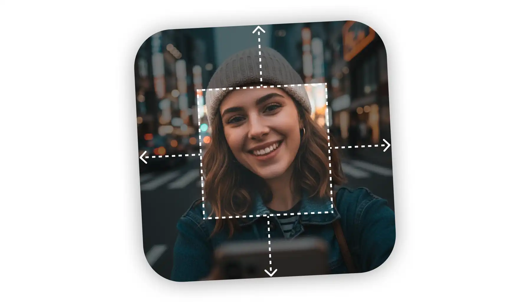 Young woman wearing a beanie smiling and holding a smartphone, with a white dashed square and arrows indicating image cropping or adjustment.