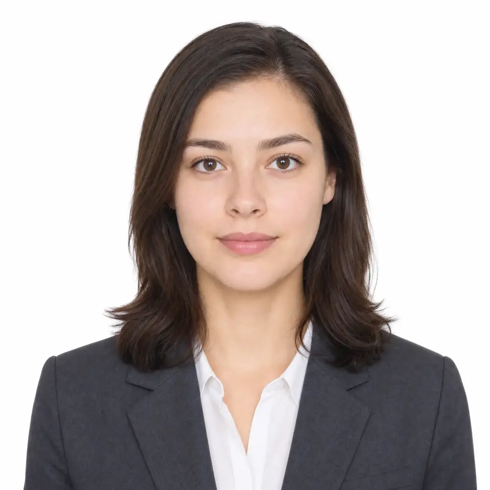 AI-generated passport photo of a woman in a dark blazer on a clean white background