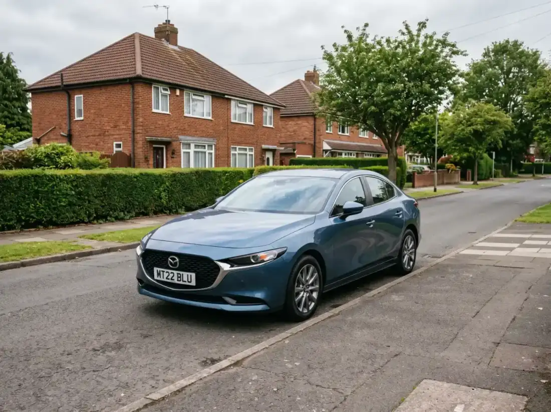 Blue sedan parked on a residential street