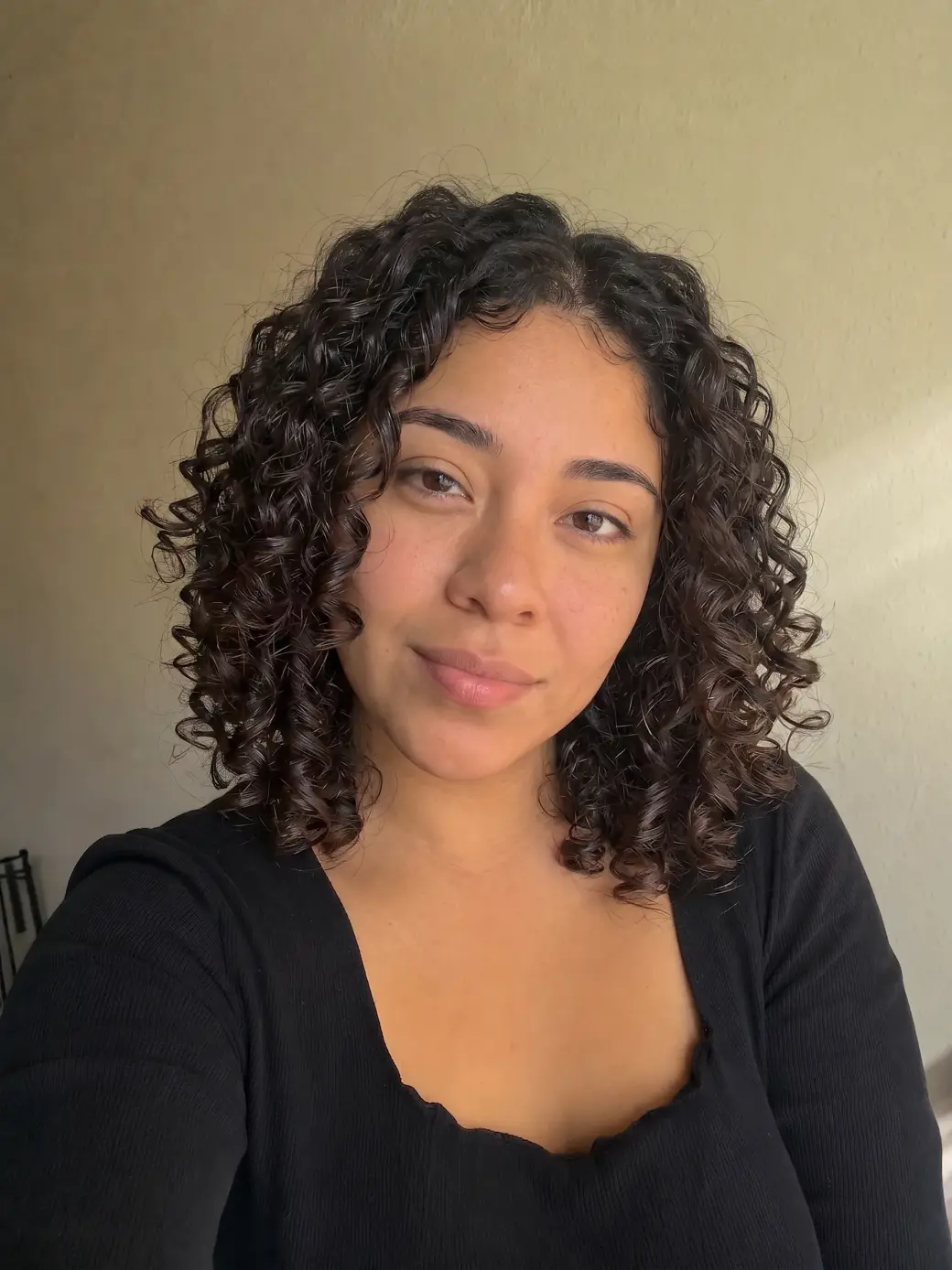 Same person with AI-generated curly hair