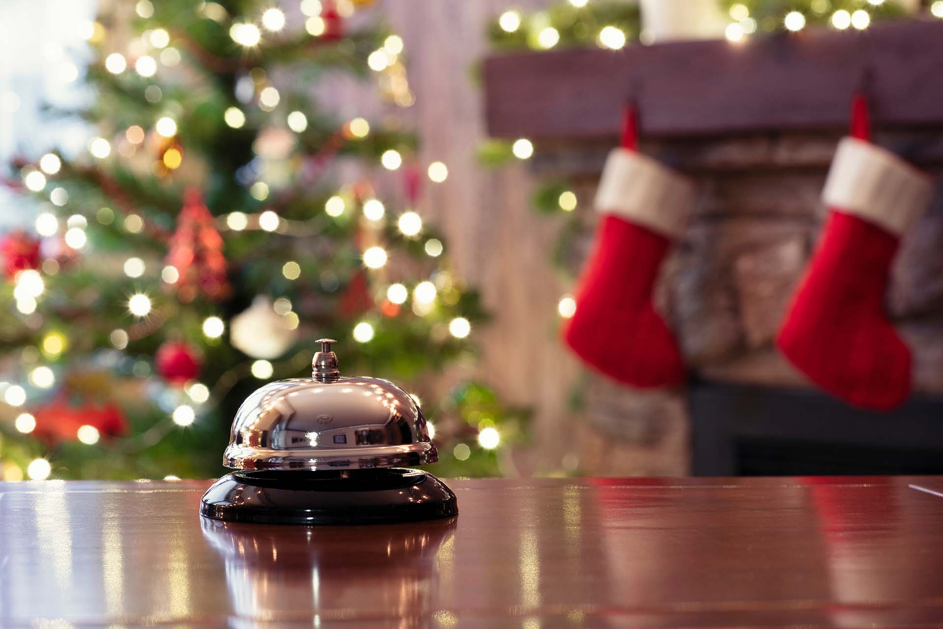 Hotel service bell with Christmas tree and festive decorations.