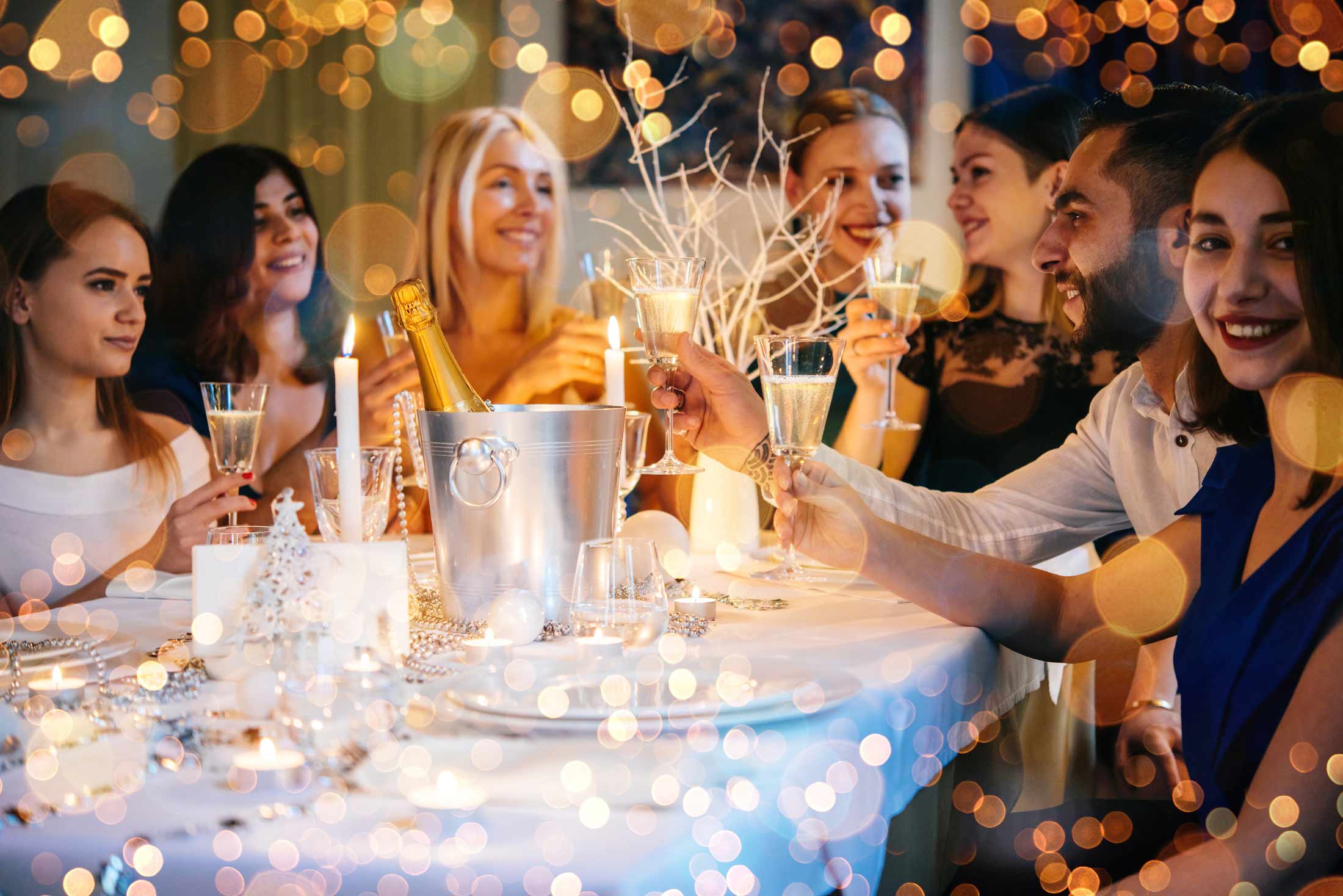 People sitting round a Christmas decorated table