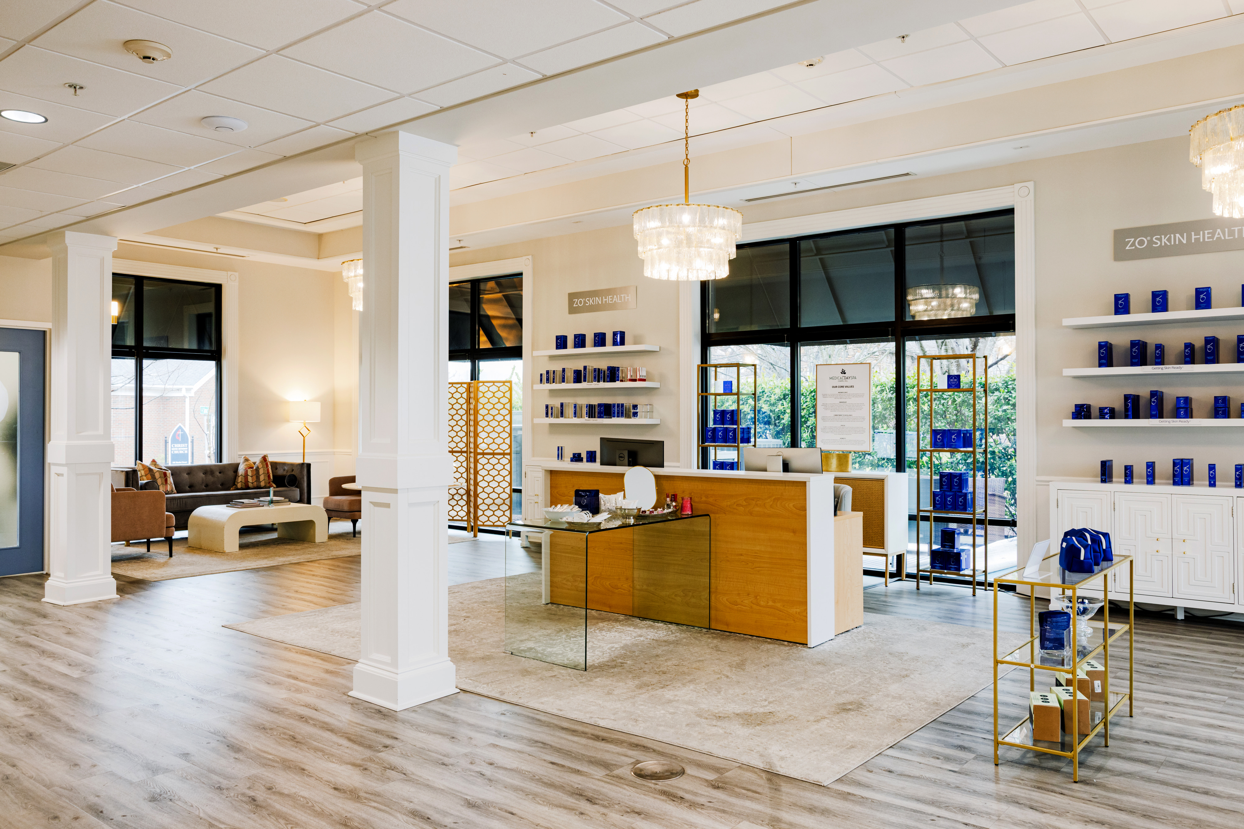 Photo of the Chael Hill day spa lobby and counter. Products on shelves 