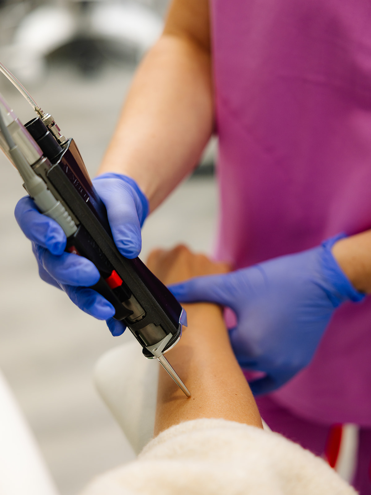 A Spa technician performing Broadband Light Therapy