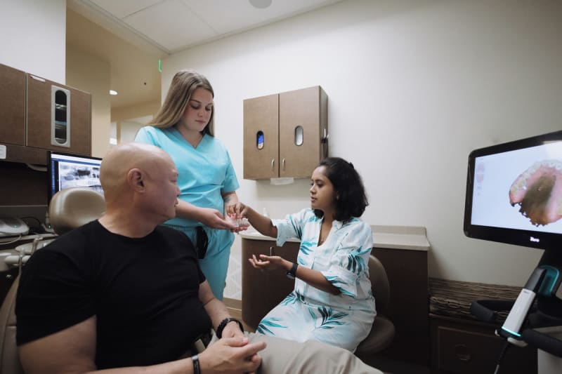Professional teeth whitening treatment discussion at Kent Station Family Dentistry with modern dental equipment and technology