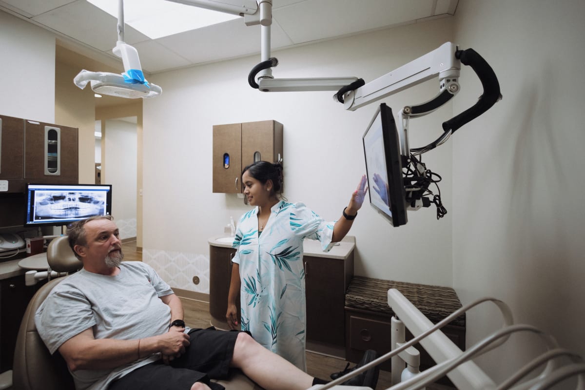 Dentist administering Botox injection for facial aesthetics and TMJ pain relief treatment