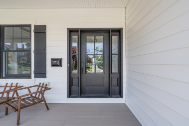 Detailed front door and window trim of new construction home in Manasquan NJ with black accents by J.A.Y. Construction 