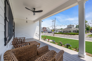 Cozy front porch view with wicker seating overlooking Manasquan NJ street, custom-built home by J.A.Y. Construction
