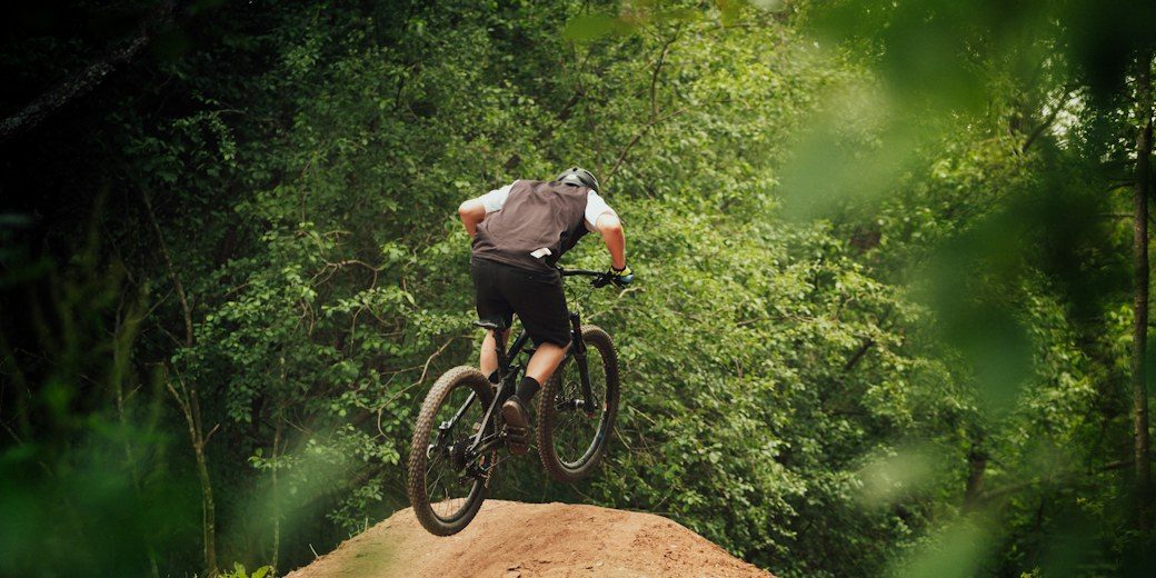 Mountain biker riding a forest trail