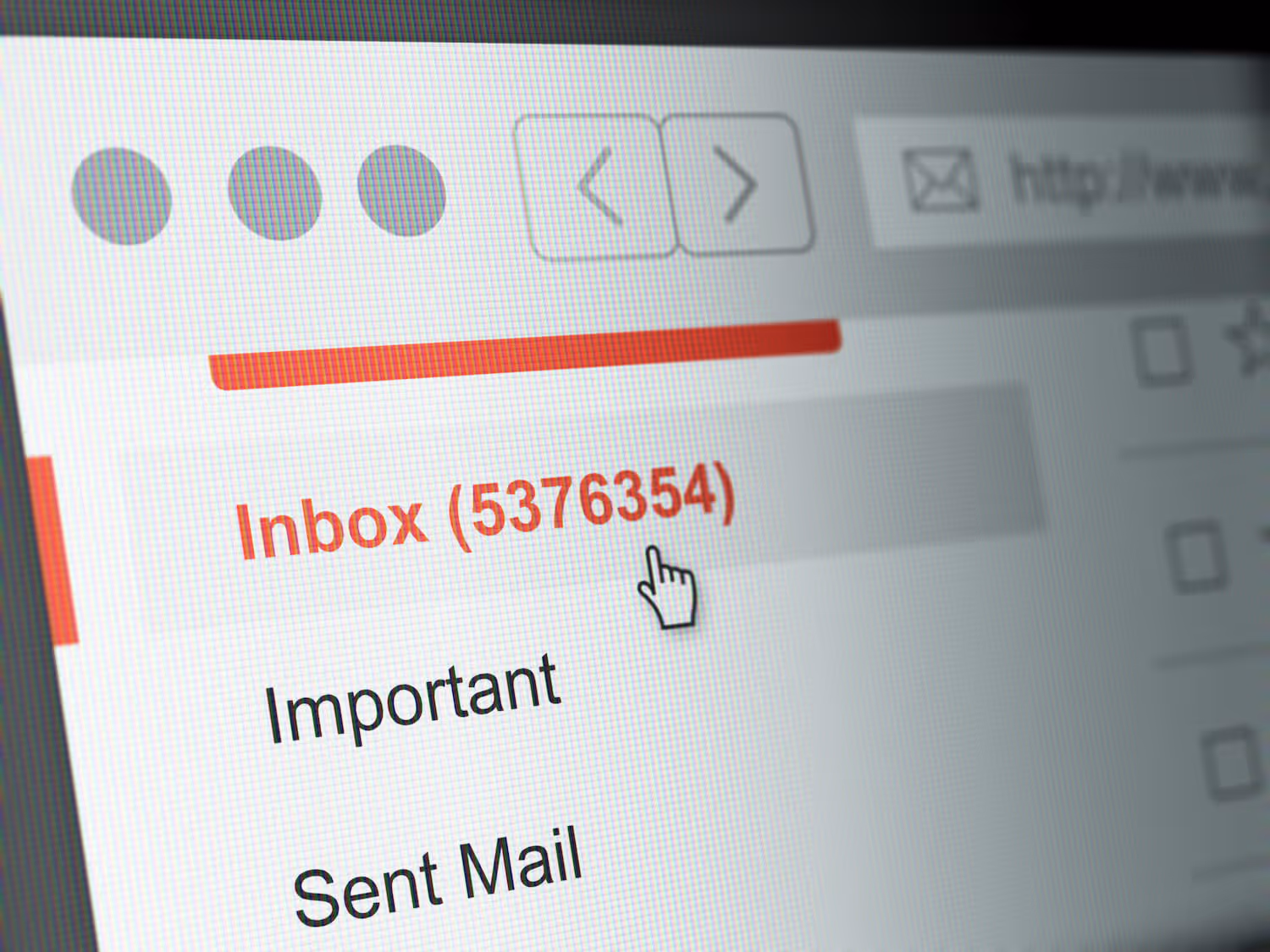 The corner of a computer monitor shows a cluttered email inbox with 5,376,354 unread emails.
