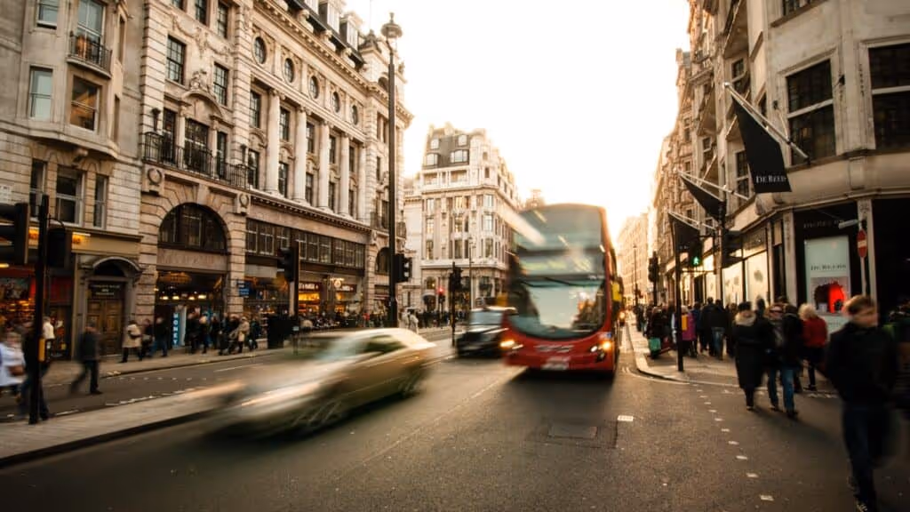 London bus driving down regent street.