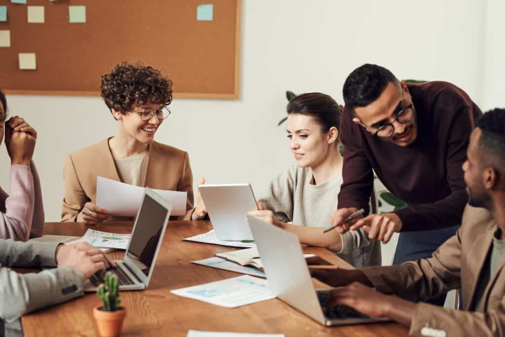 Group of employees in an office doing employee engagement activities.