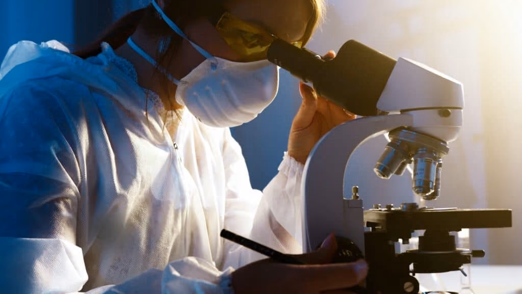 A healthcare practitioner examining something under a stethescope. 
