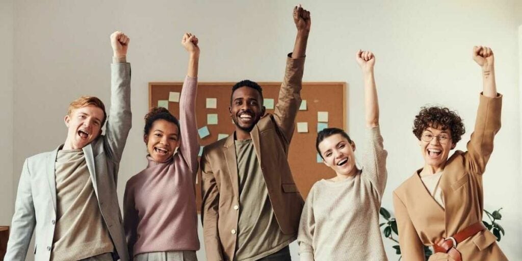 High morale employees at work demonstrate why team building is important