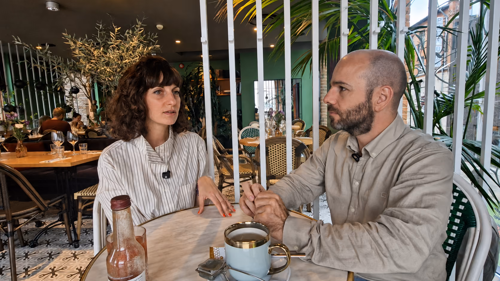 Hypnotherapist talking with a client during an in-person session