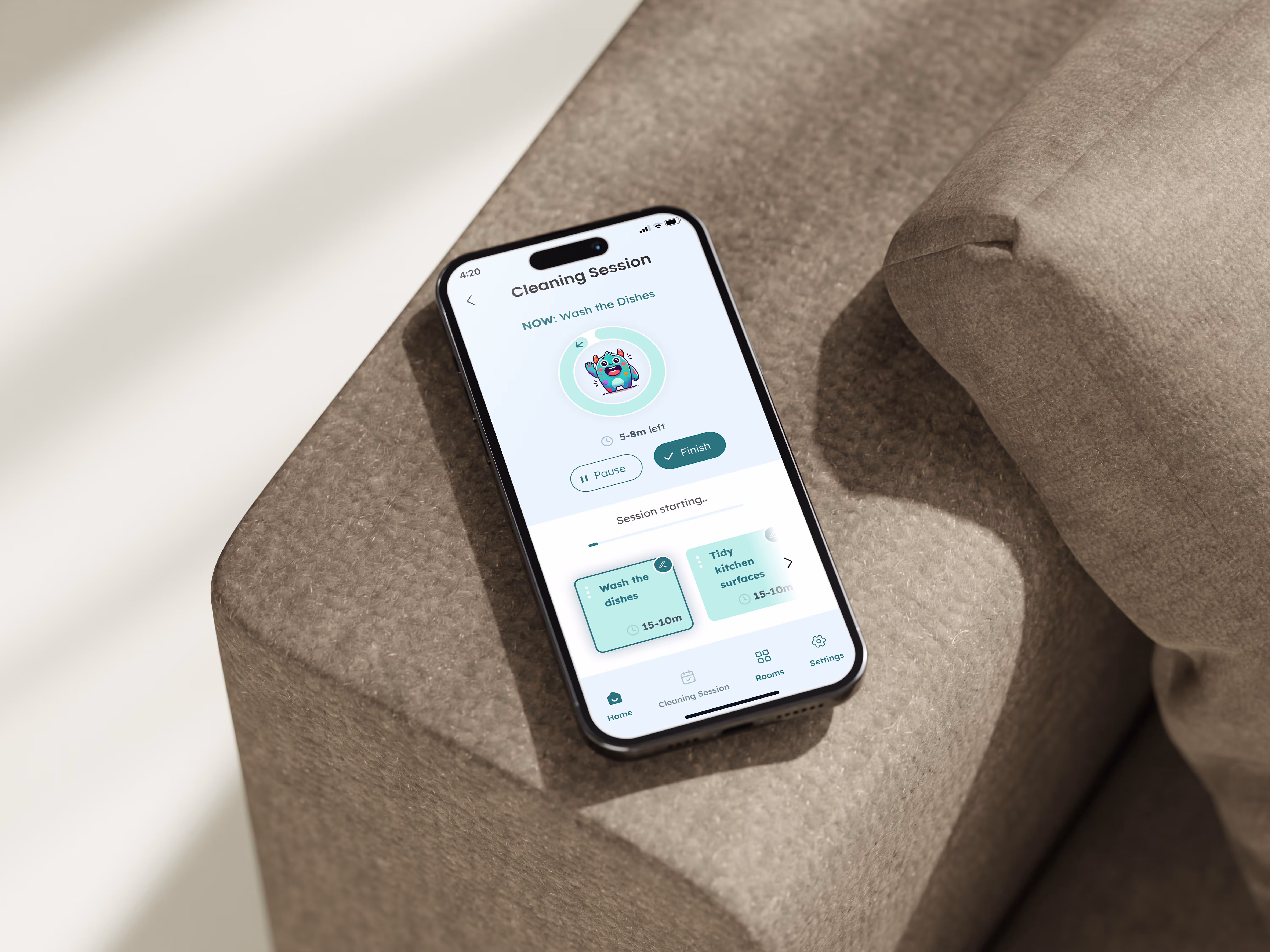 A mobile phone on the couch during a cleaning up session with tidyapp