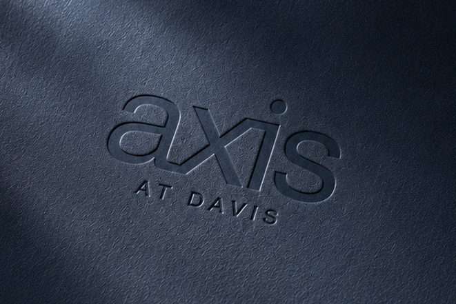 Axis Davis logo on dark paper with shaddow