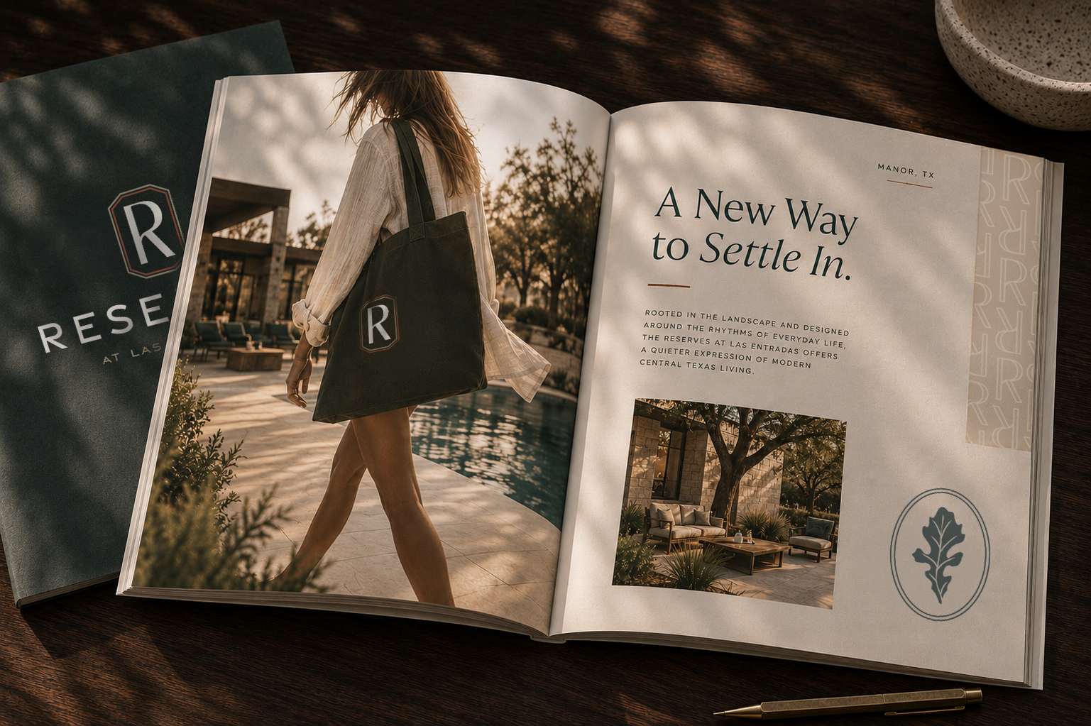 Open Reserves at Las Entradas brochure featuring branded lifestyle photography, Texas-inspired typography, and the oak leaf mark on a dark wood table.