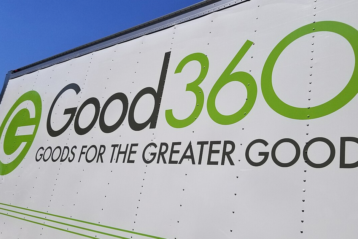 Good360 delivery truck with green and gray “Good360: Goods for the Greater Good” logo